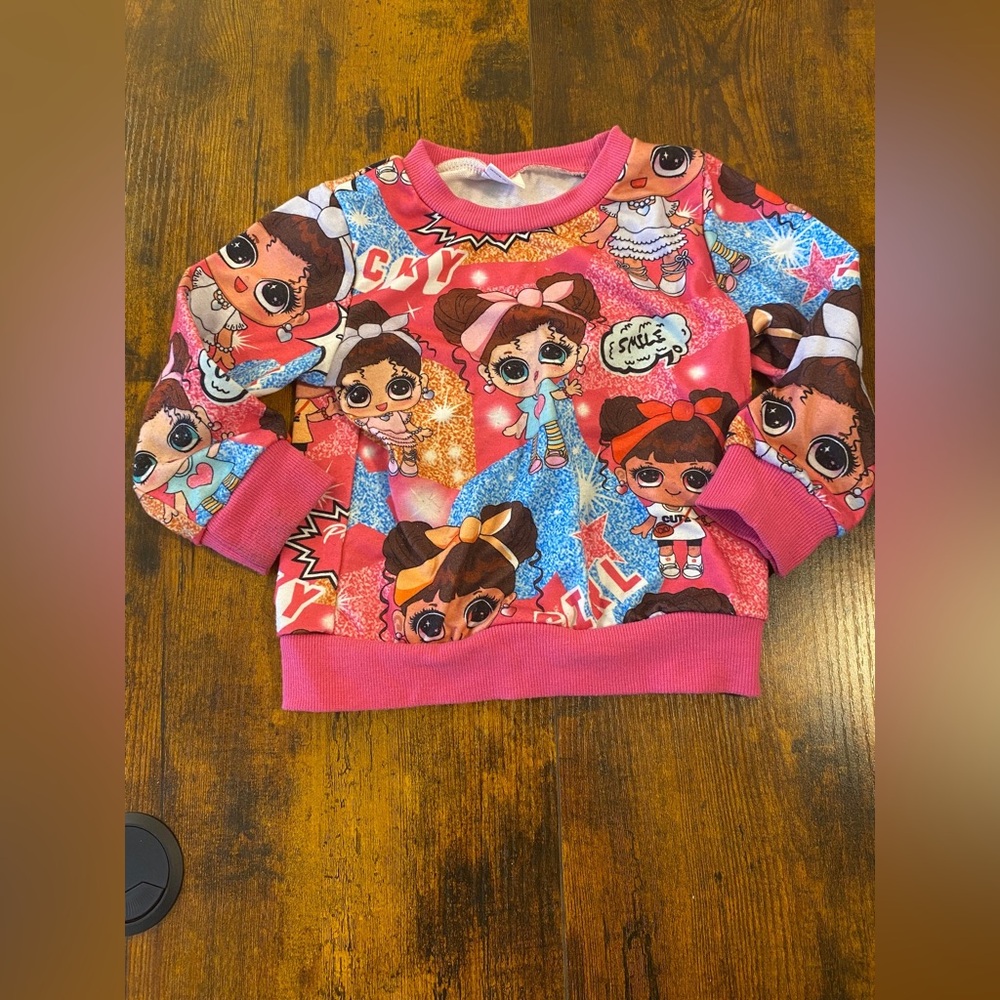 Item 87 Girls Cute Doll Printed Sweatshirt
Size 12-18 months.